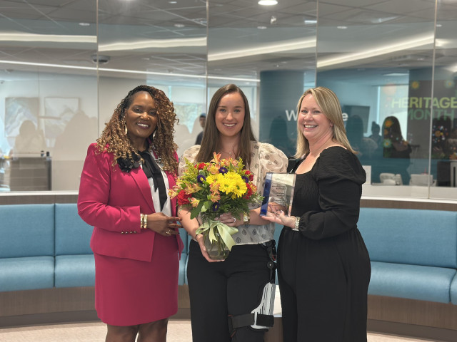 Corinne Twombly and others posing with flowers and the Direct Patient Care Award from ARN in 2025